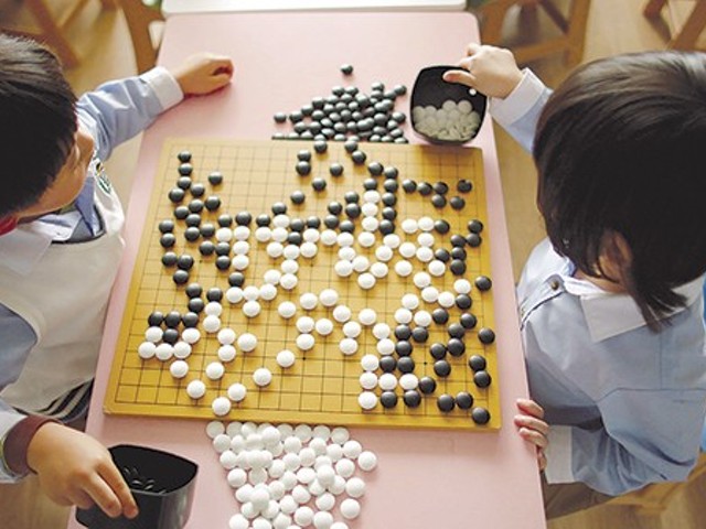 An AI challenges the world's best player of the Japanese game Go in Alpha Go.
