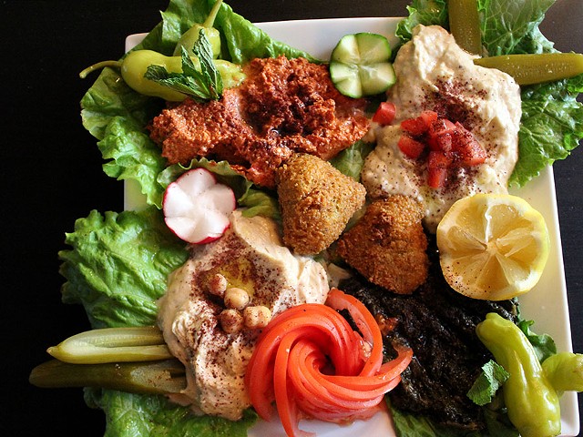 The vegetarian platter has hummus, batata harra, which is a potato dish, mohamara, a hot pepper dip, and baba ganoush along with fresh vegetables, pickles and falafel. It costs $15.25.