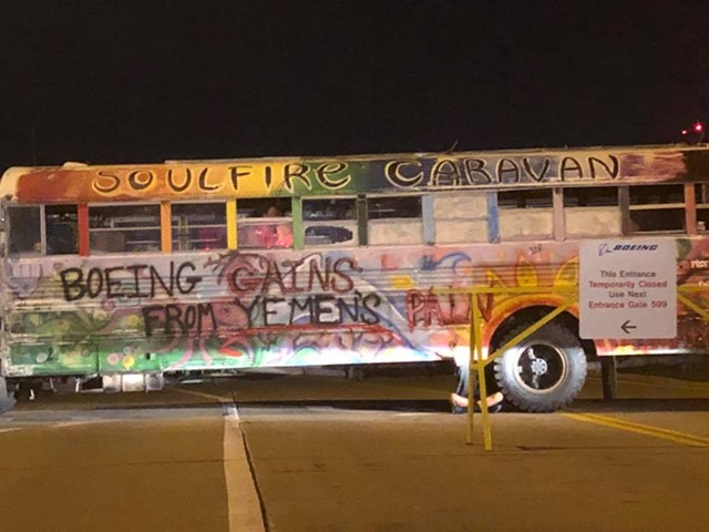 A painted bus used to block entrance to a Boeing facility this morning.