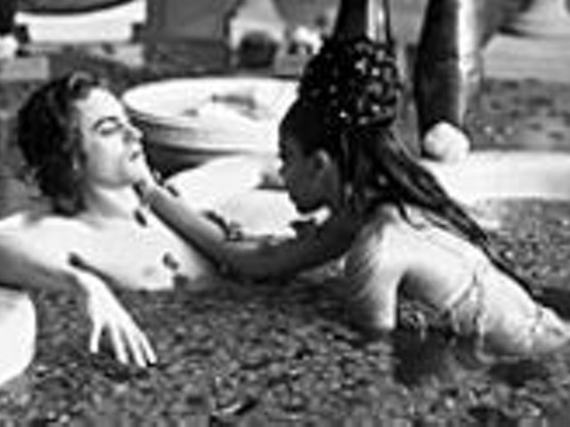 Hell on earth, with a little slice of heaven: Stuart Townsend and the late Aaliyah take a dip in the Damned.