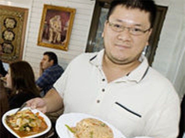 Simply Thai co-owner Scott Truong shows just a few of the 100 options on the menu.