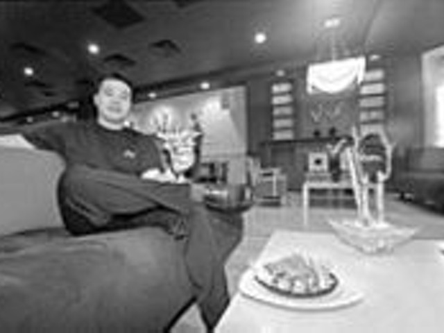 Just loungin': Manager Thach "Toc" Le of the Drunken Fish kicks back with a So roll