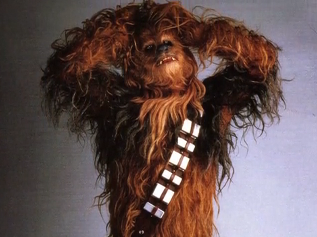 Inside that famous furry costume is Peter Mayhew.