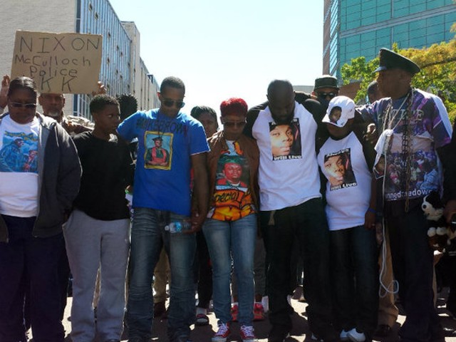 Michael Brown's family at a protest in Clayton last summer.