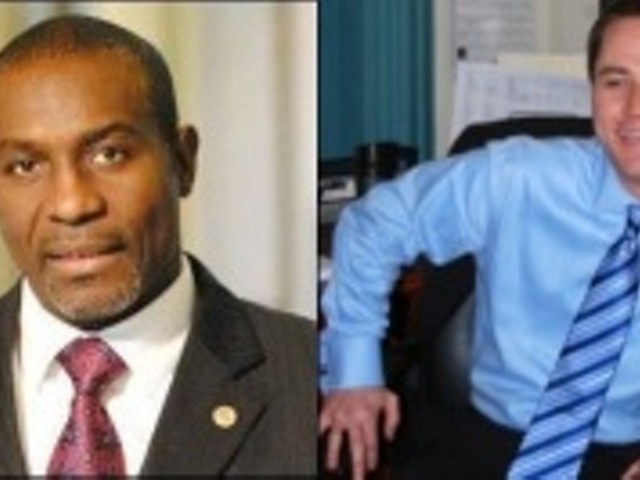 Board President Lewis Reed (left) and former campaign manager Matt Teter