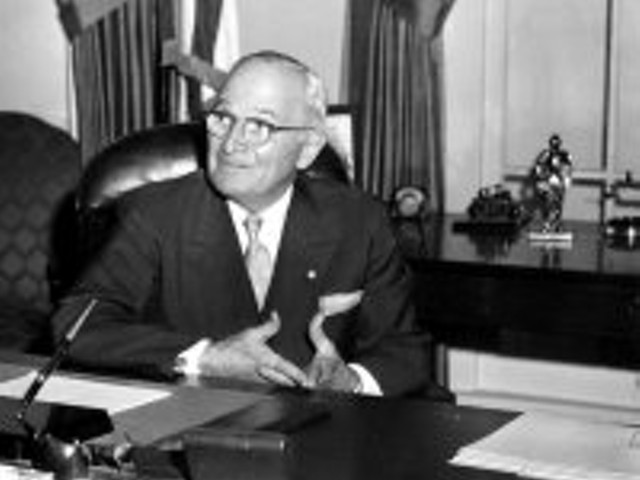 Harry Truman and his "The Buck Stops Here" placard.