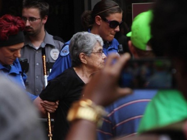 Hedy Epstein, center, is arrested outside the Wainwright Building in downtown St. Louis on August 18.