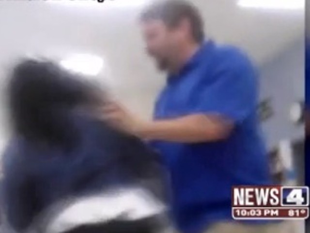 Teacher shoving a student.