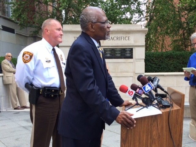 County Executive Charlie Dooley, with police chief Jon Belmar behind him, tells media he is disappointed in the lootings Sunday night in Ferguson. "I understand the community's frustration and desire for information."