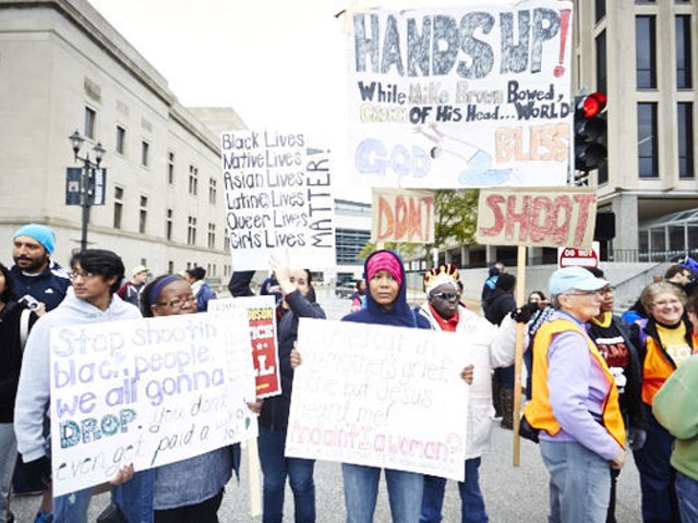 Protesters brought handmade and printed signs to the Ferguson October protest march on Saturday, October 11, in downtown St. Louis.