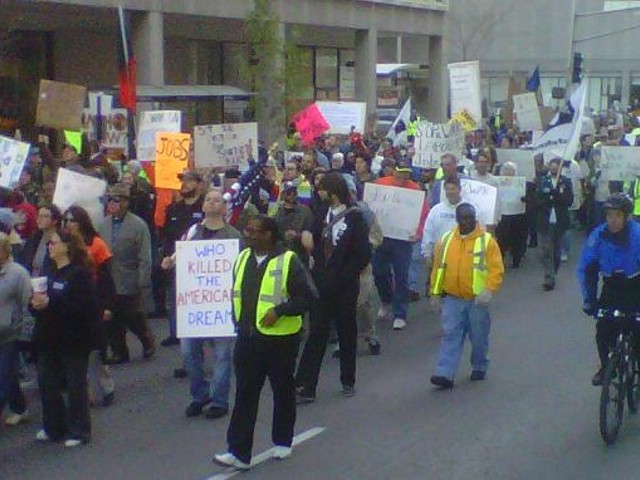 Occupy STL protesters march to the MLK Bridge yesterday afternoon.