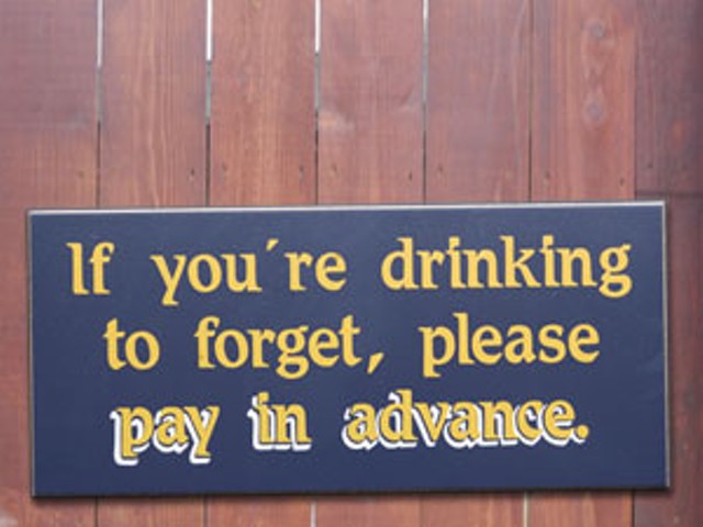 This sign hangs at more than one St. Louis bar