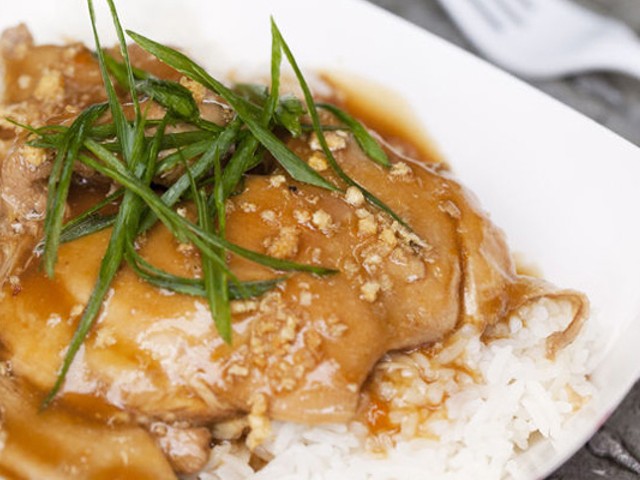 Chicken Adobo with soy sauce and vinegar braised chicken thighs served over steamed jasmine rice with green onions. | Jennifer Silverberg