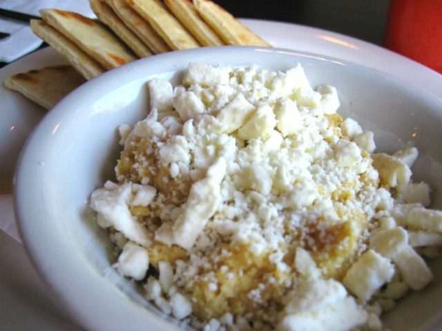 House-made hummus served with warmed pita, feta cheese and scallions at MoKaBe's.