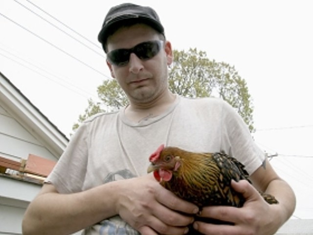 Chef holding his Partridge Rock hen