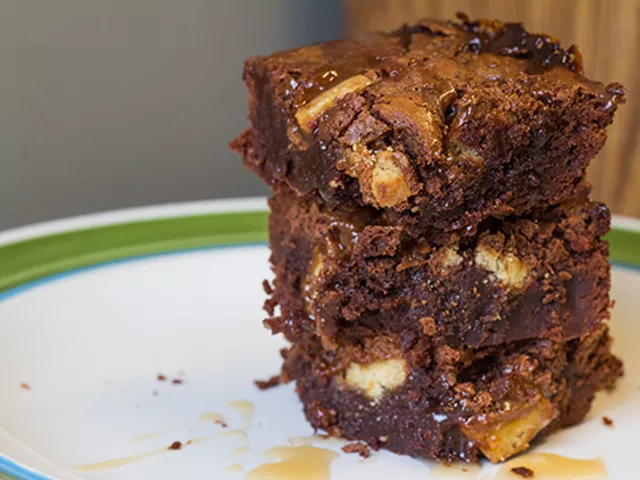 Fudge brownies laced with Twix chunks and bourbon salted caramel sauce.