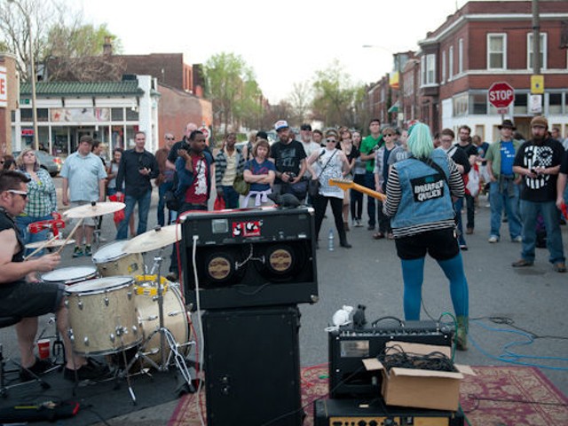 Bruiser Queen performing outside of Apop Records.