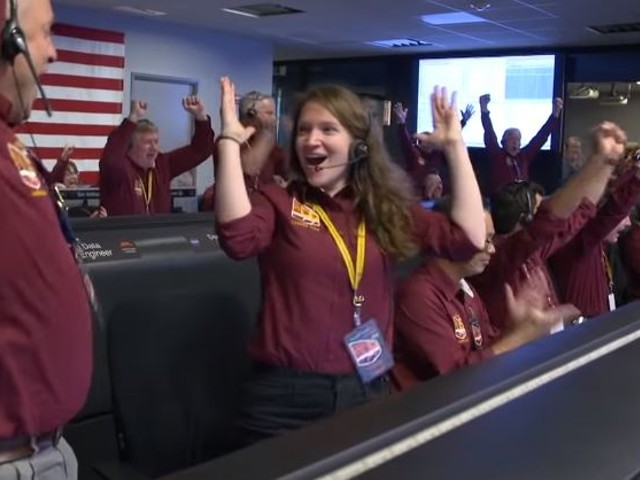 University of Missouri grad Brooke Harper and a fellow NASA engineer celebrate InSight's landing.