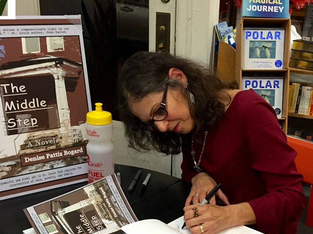 Bogard signs her new book, "The Middle Step," at Left Bank Books. "I’m an author who created from her imagination and her experiences a cast of characters who lived in my head for almost a decade,” she says.
