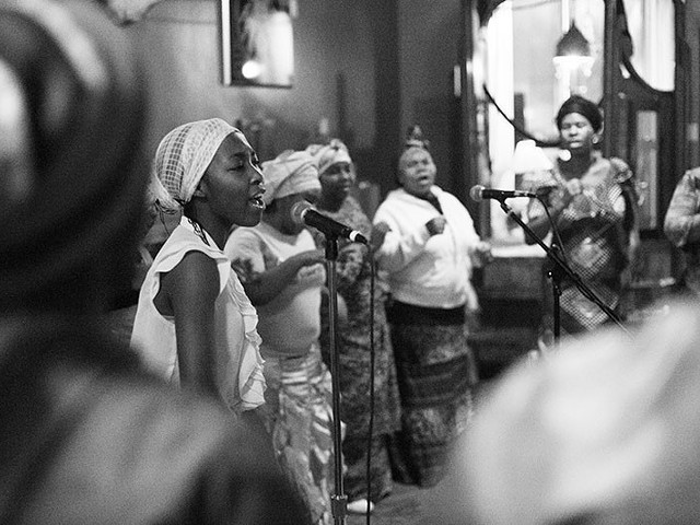The Voice of the Holy Spirit Choir performing during a 2014 Texas Room fundraiser at the Fortune Teller Bar.