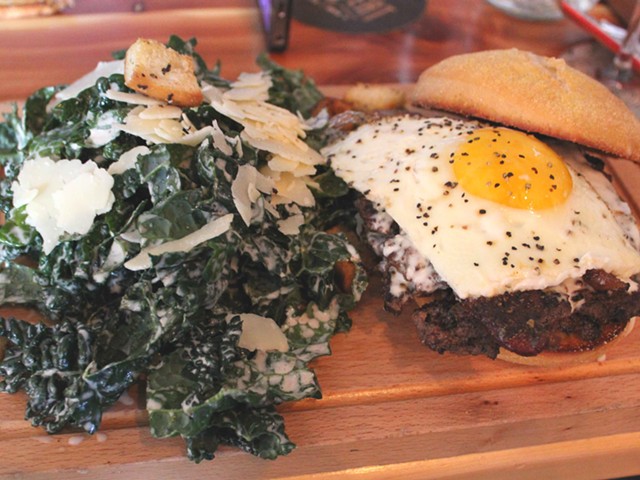 The farmhouse burger with kale Caesar salad.