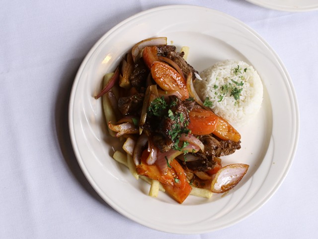 Lomo Saltado: Sauteed tenderloin steak, served with onions, tomatoes, rice and fries.