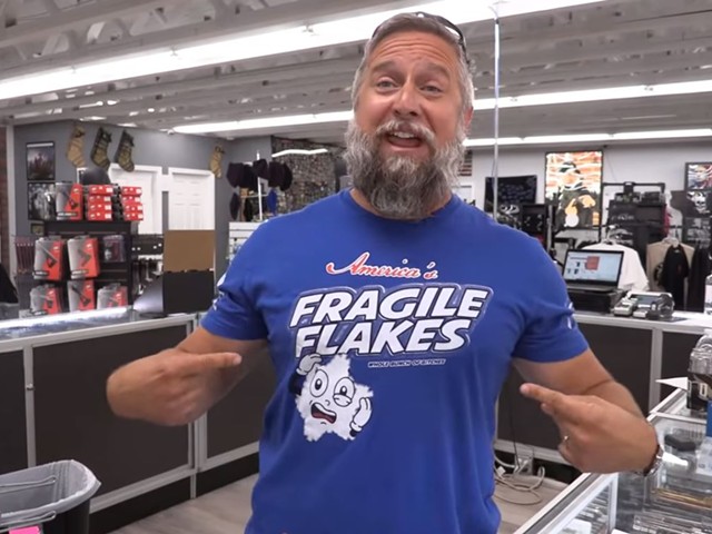 Tactical Shit owner T.J. Kirgin models one of his shop's t-shirts.