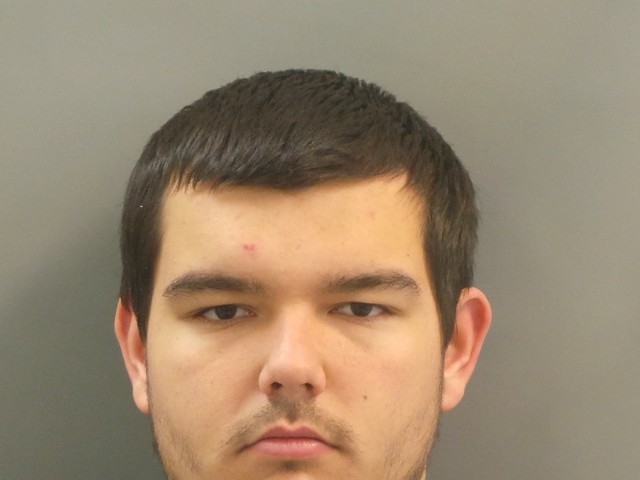 Nicholas Keeton was charged with impersonating a police officer.