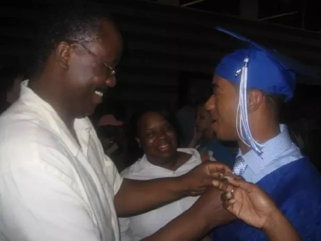 Jordan Nichols, currently serving 15 years in prison, shown here after his high school graduation with his mother and stepfather.