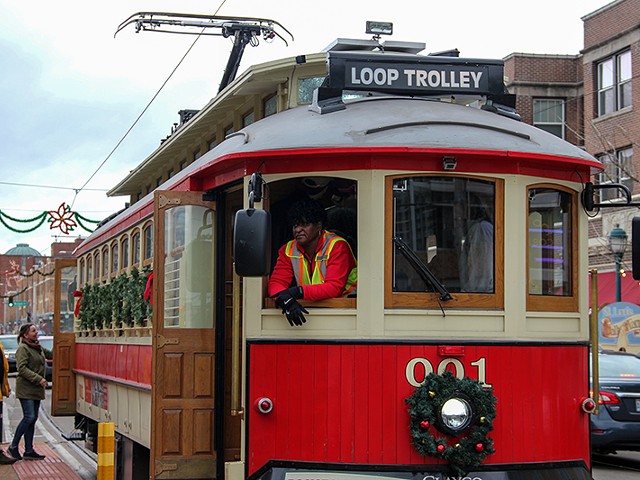 A worker on a packed Delmar Trolley on Sunday.