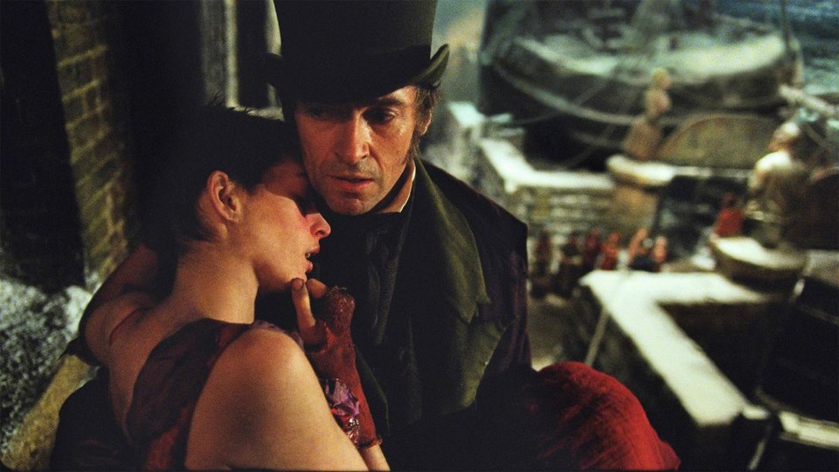 Les Miserables stays true to itself onscreen. A very ill Fantine (Anne Hathaway) is held by Jean Valjean (Hugh Jackman).
