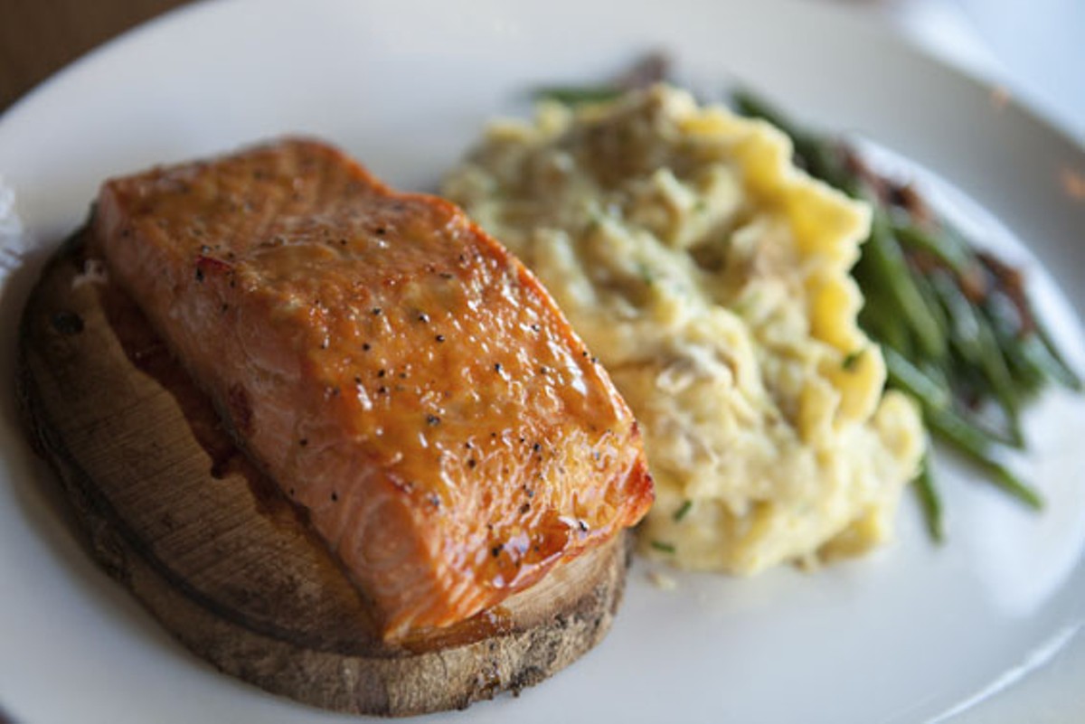 Maple-plank bourbon salmon dinner, served with Yukon smashed potatoes and green beans with pecans. See more photos of J. Gilbert's here.