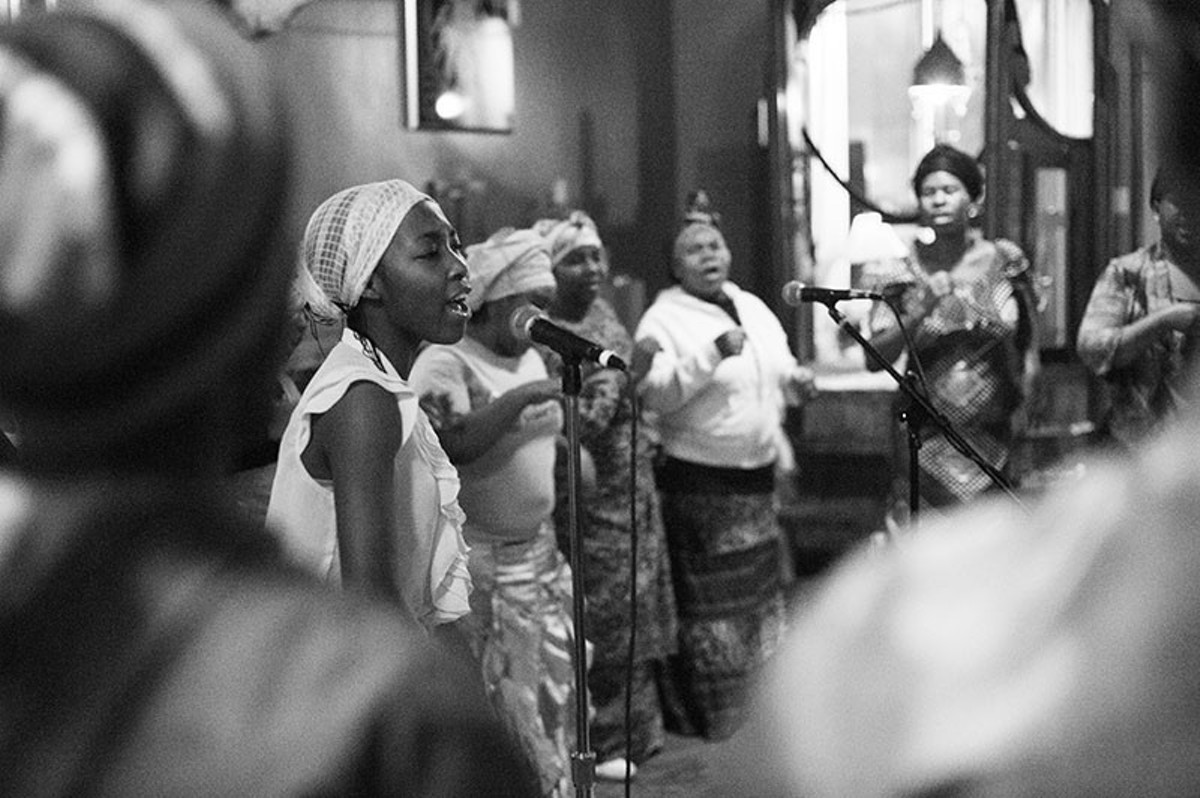 The Voice of the Holy Spirit Choir performing during a 2014 Texas Room fundraiser at the Fortune Teller Bar.