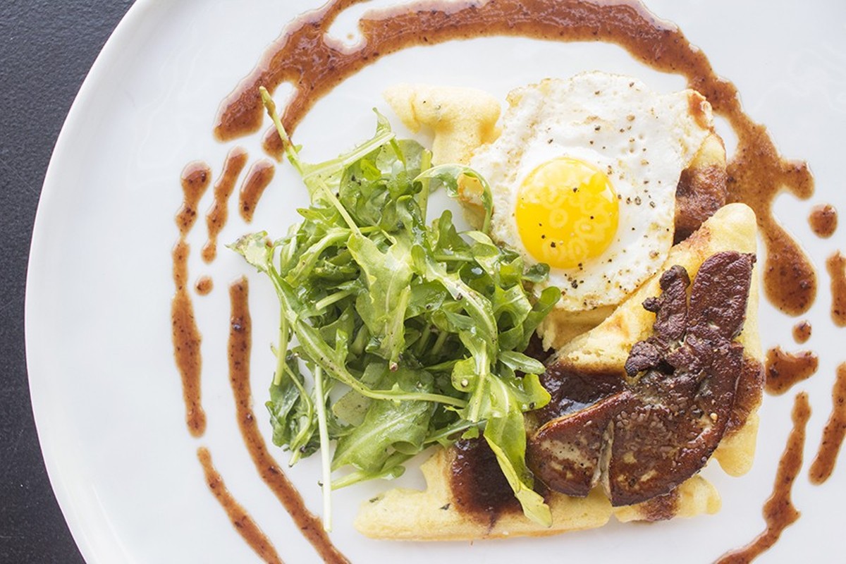 The "Foie 'n' Waffle": Seared foie gras, rosemary waffles, quail egg, arugula and port wine red currant syrup.
