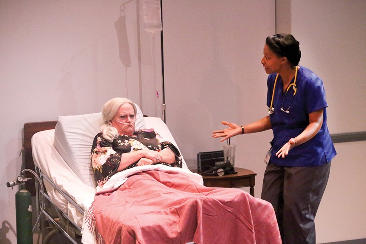 Maxine (Kim Furlow) and Tina (Jeanitta Perkins) argue about Maxine's care.