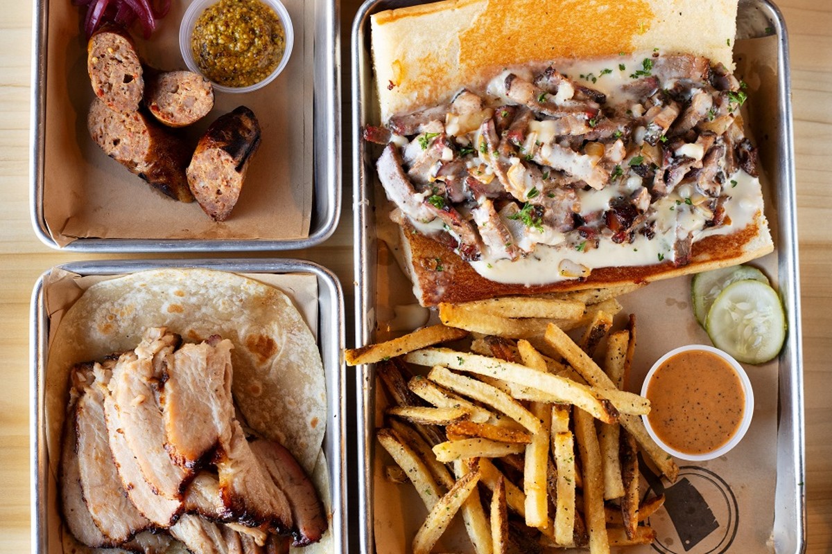 A selection of items from BEAST Butcher & Block (pictured from left to right, top to bottom): housemade spicy bratwurst, basted belly and #Beercheesesteak sandwich with fries and basted belly with fresh tortillas.