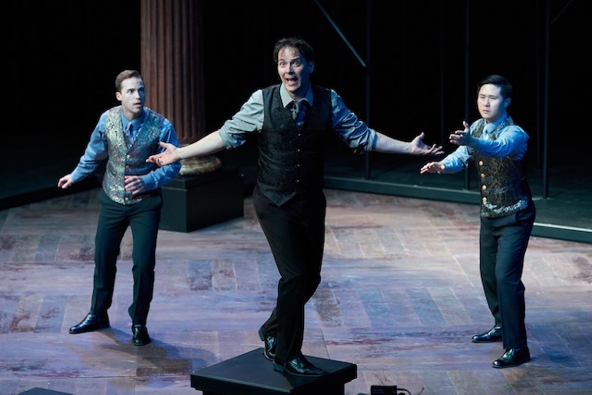 Rosencrantz (left, Ross Cowan) and Guildenstern (right, Stephen Hu) try to figure out how crazy Hamlet (center, Jim Poulos) really is.