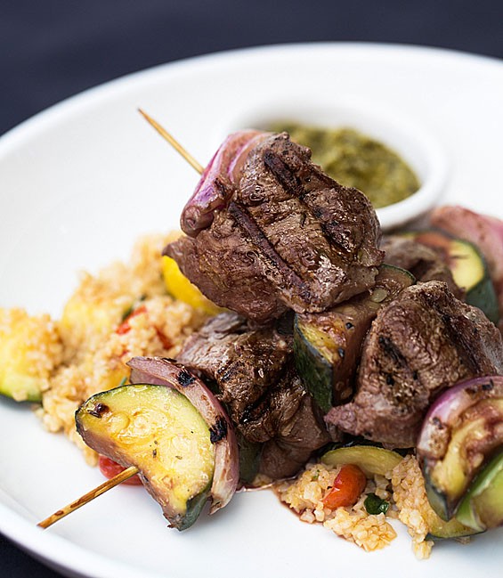 J Greene's eight-ounce beef tenderloin kabobs come grilled with squash, zucchini, onions, peppers, warm tabouleh salad and chimichurri sauce. See also: Inside J Greene's Pub.