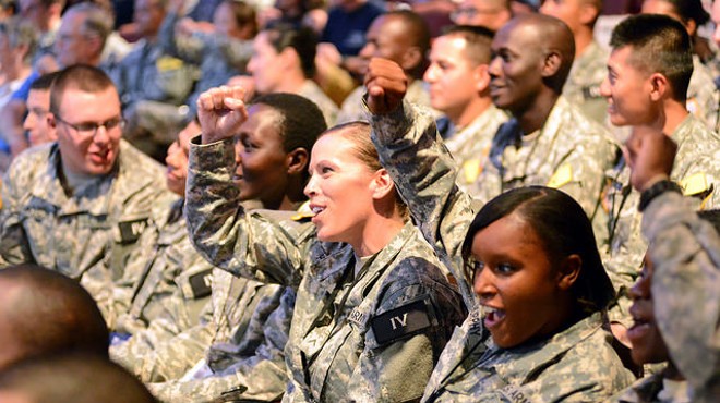 Soldiers cheer entertainment at a base in Texas. The U.S. Army has recently released a database cataloguing reports of assault.