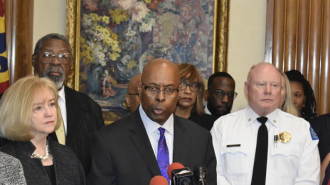 Public Safety Director Jimmie Edwards (center) announces a gun buyback in St. Louis.