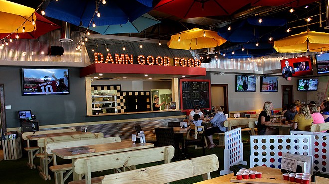 The restaurant's motto hangs above the kitchen: "damn good food,"