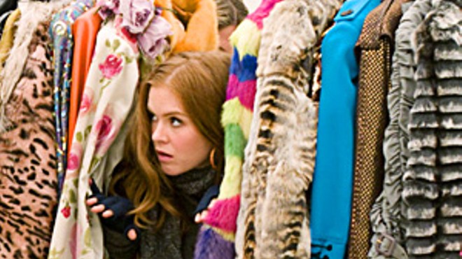 Rebecca Bloomwood (Isla Fisher) hides 
    her financial woes behind shameless 
    fashion plugs.