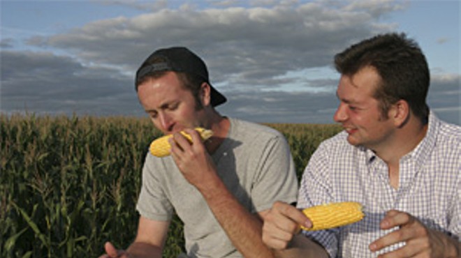 Holy crop! Ian Cheney and Curt Ellis sample the fruits of their labor from an acre of their farmland in Greene, Iowa.