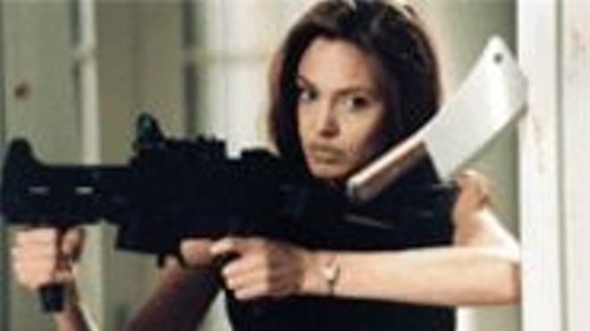 Killer looks: Angelina Jolie (pictured) and Brad Pitt 
    take aim at one another.