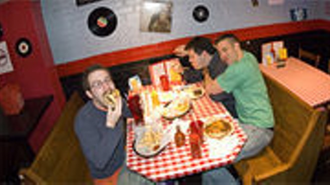 After hours: (clockwise from left) Jon Huntley, Ilya Feldman and Daniel Defosset partake of some diner grub.