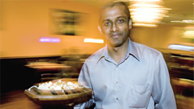 Akram Hoque, one of Saffron's three owners, serves traditional Indian fare.