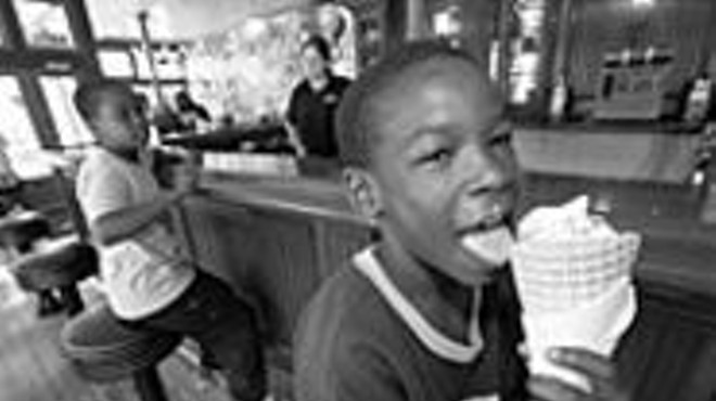 We all scream for ice cream: Ra'Heam Hudson 
    (background) waits for a cone as Ryan Moore 
    (foreground) enjoys his.