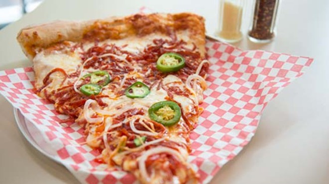 On this piece of pizza &mdash; from a 30-inch pie &mdash; comes shredded pepperoni, fresh jalape&ntilde;os and onions. Slideshow: Photos from inside King Louie's Empire Pizza.