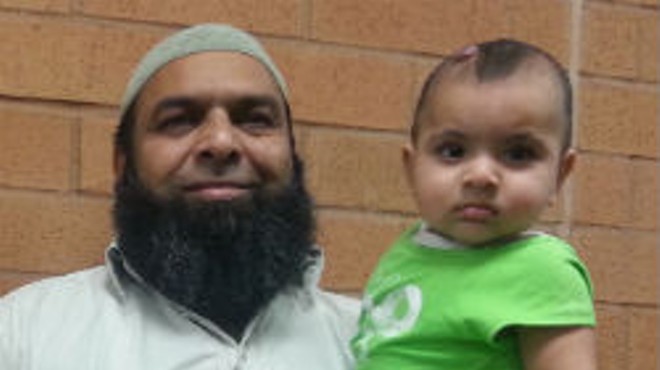 Raja Naeem and his youngest child.