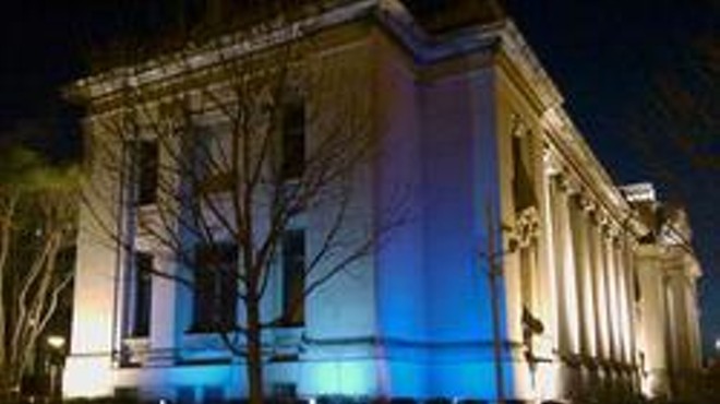 The Missouri History Museum shines in blue.